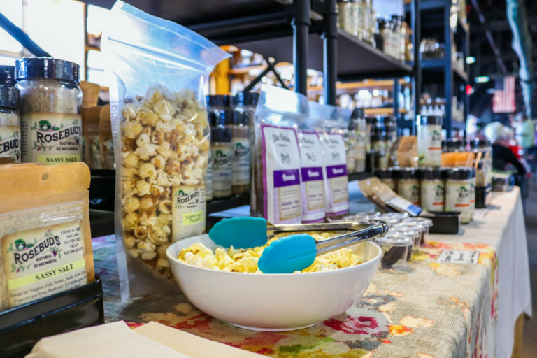 Organic popcorn and seasoning display at an Ohio farmers market showcasing local food products.